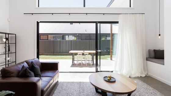 Tidy room with sliding door open to let fresh air around the house